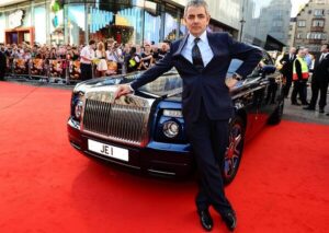 A picture of Rowan Atkinson with one of his cars